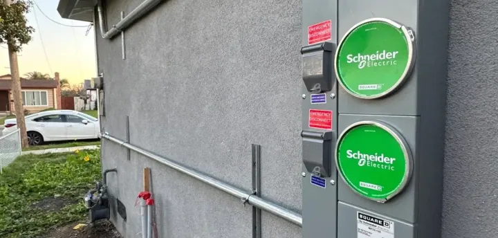 200-amp duplex meter main with two Schneider Electric meter sockets installed on a Sacramento home for an ADU