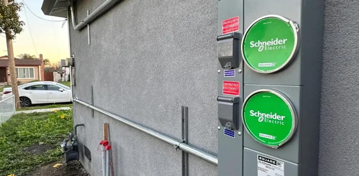 200-amp duplex meter main with two Schneider Electric meter sockets installed on a Sacramento home for an ADU