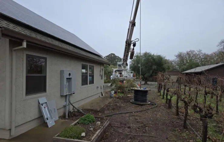 Crane assisting an overhead electrical service job at a Sacramento area home
