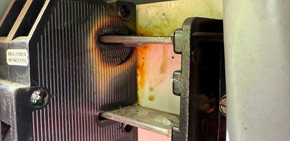 Burnt circuit breaker discovered during an emergency electrical call