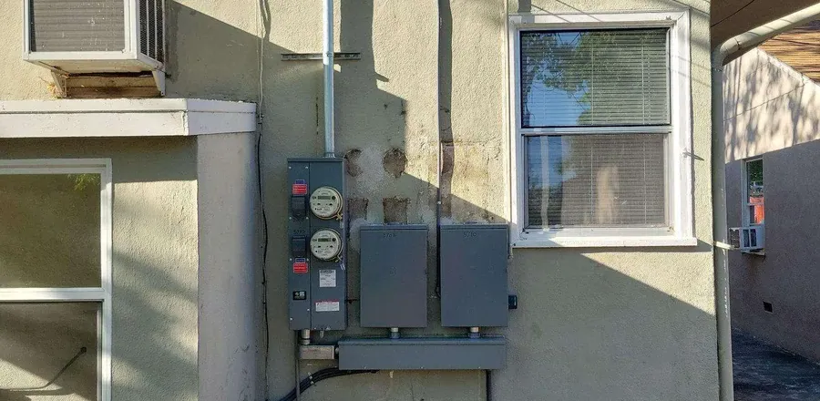 Aging electrical meter and panel on an older Sacramento home
