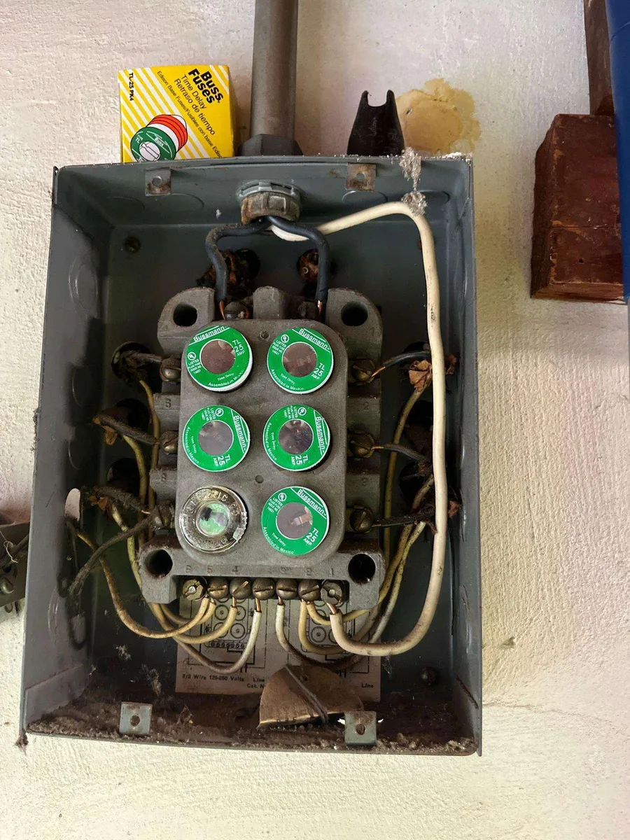Old fuse panel in a Sacramento home before a modern 200-amp upgrade