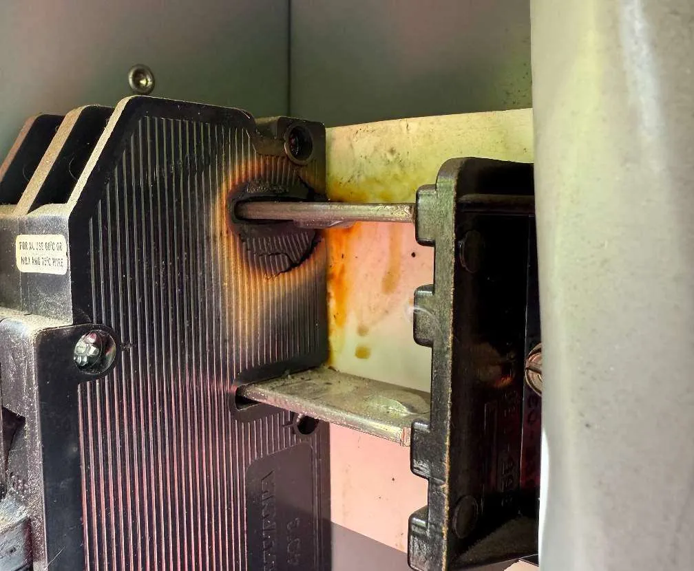 Burnt circuit breaker discovered during an emergency electrical call